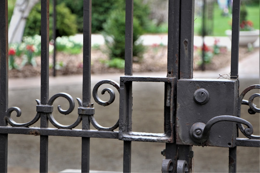 A custom metal driveway gate on a Pearland home
